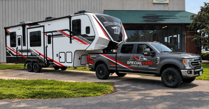 Special Lane Towing Services pickup truck towing a fifth-wheel camper